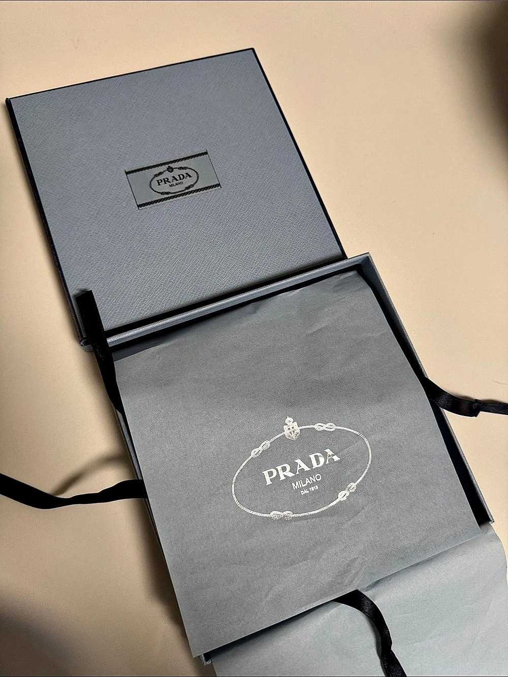 Prada luxury collection gift box with tissue and attachment straps